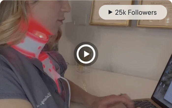 Woman using red light therapy device (trusted_img_2)